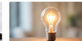 Glowing light bulb representing practical ideas and techniques.